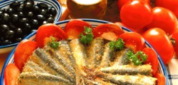 Сардины, запеченные с белым вином и панировочными сухарями