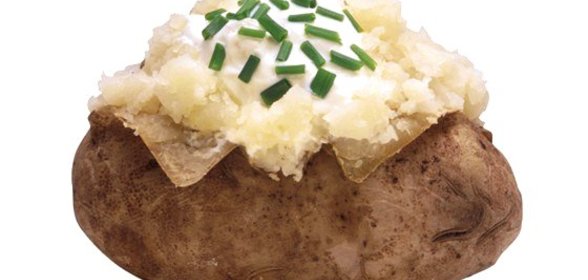 Запеченные половинки картофеля с сыром грюйер и шнитт-луком