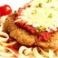 Телятина под сыром с томатным соусом, анчоусами и каперсами