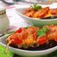 Запечённые половинки баклажанов с помидорами и сыром