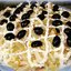 Салат с креветками и кальмарами и кукурузой
