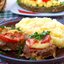 Мясные котлеты запечённые с помидорами и луком в духовке