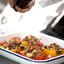 Запеченный перец с кускусом и фетой на подложке из запеченных овощей