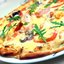 Пицца с рыбой, крабами и соусом из морской капустой
