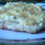 Свинина, запеченная с луком и сыром