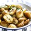 Печеные картофельные дольки с чесноком и розмарином