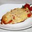 Куриные отбивные с помидорами под сыром