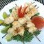 Мясо крокодила на шпажках
